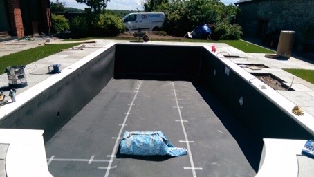 Installing the underlay prior to fitting the DIY pool kit liner