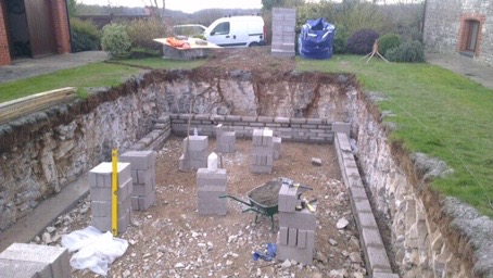 Excavating the ground in preparation for building a DIY pool